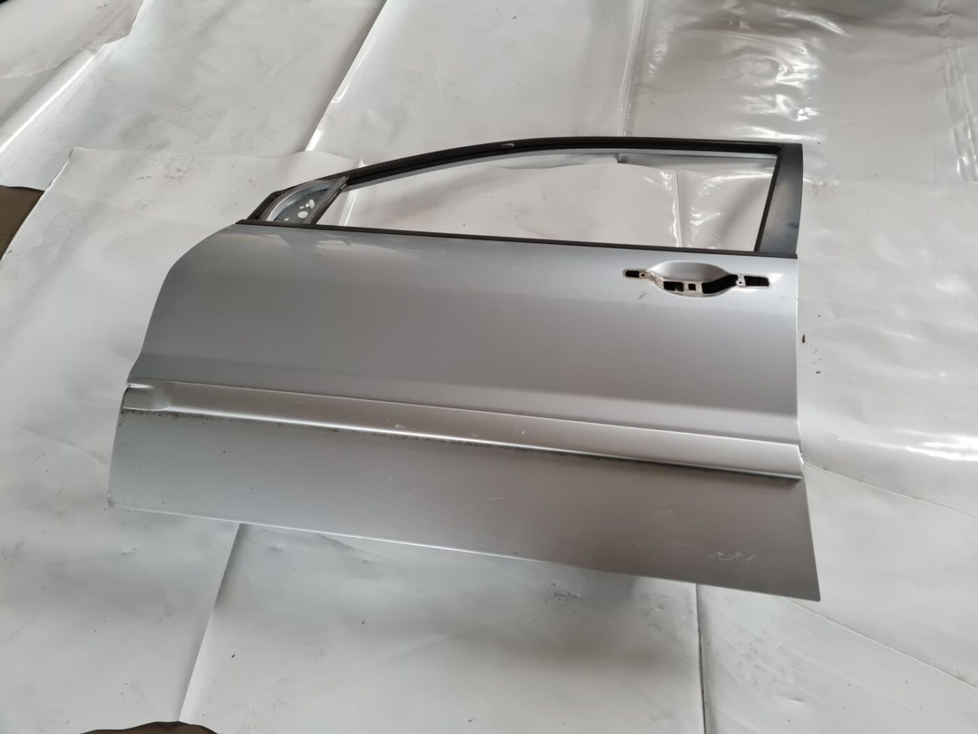 Priekšējās kreisās durvis priekš MITSUBISHI LANCER 2006 1 Priekšējās kreisās durvis priekš MITSUBISHI LANCER 2006