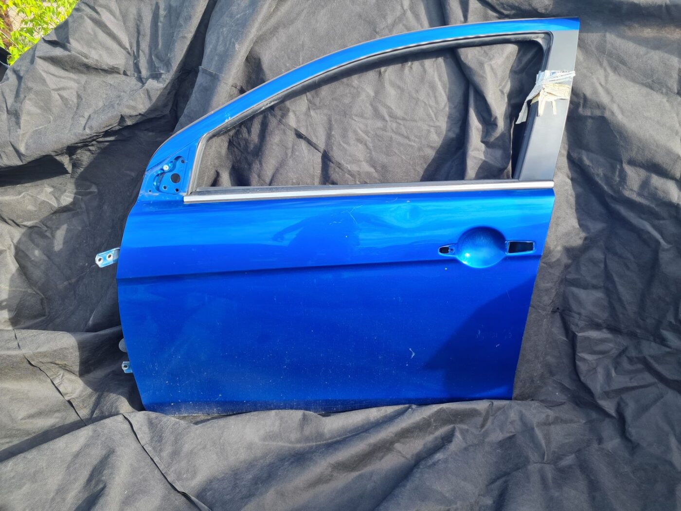 Priekšējās kreisās durvis priekš MITSUBISHI LANCER 2009 1 Priekšējās kreisās durvis priekš MITSUBISHI LANCER 2009